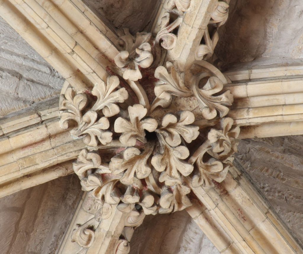 Image of boss in the Angel Choir at Lincoln Cathedral showing pinched trefoil foliage 