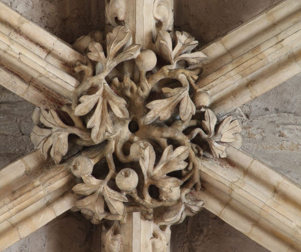 Image of boss in the Angel Choir at Lincoln Cathedral showing hawthorn with berries