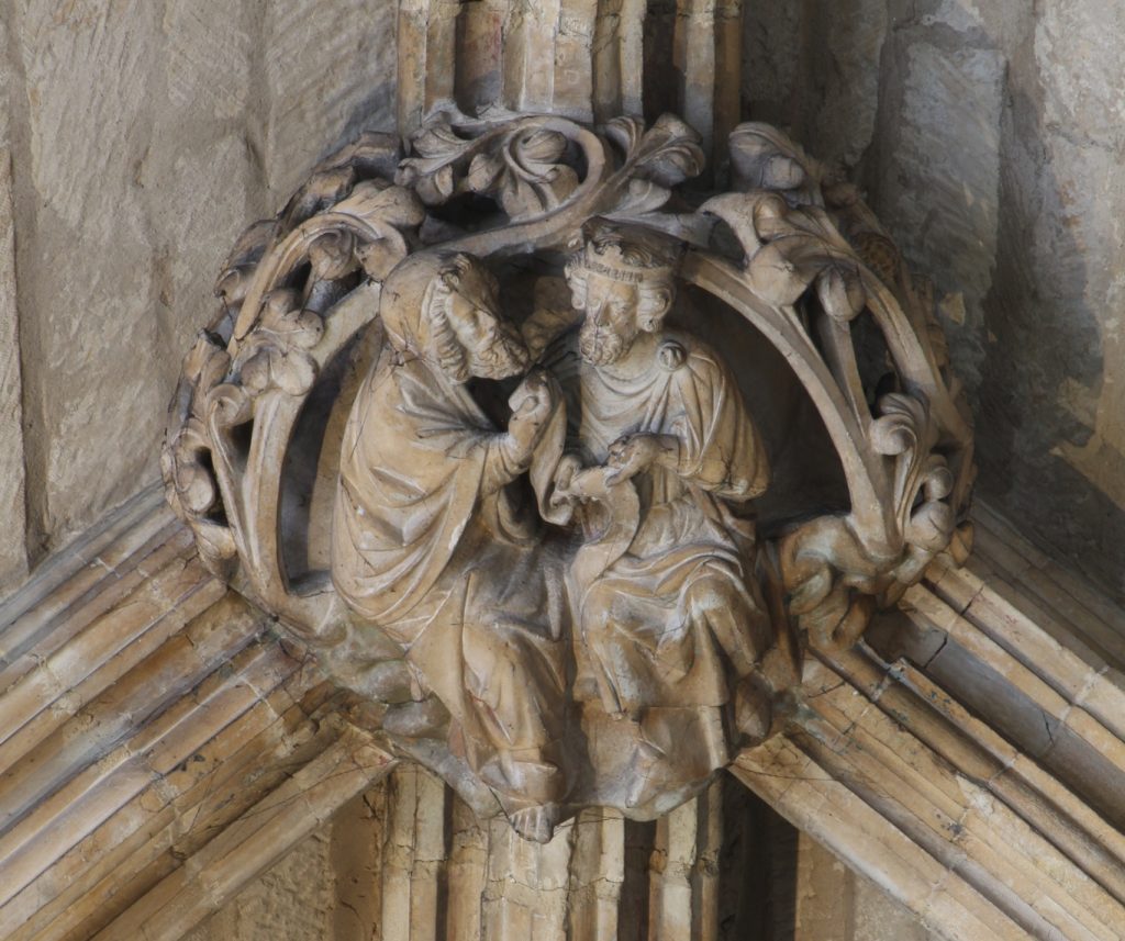 Image of boss in the Angel Choir aisle at Lincoln Cathedral, showing a discussion between a king and an elder, probably a scene from the Old Testament