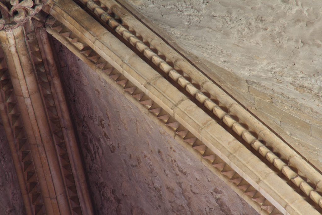 Image of dogtooth pattern rib moulding in the southernmost bay of the east transept at Lincoln Cathedral